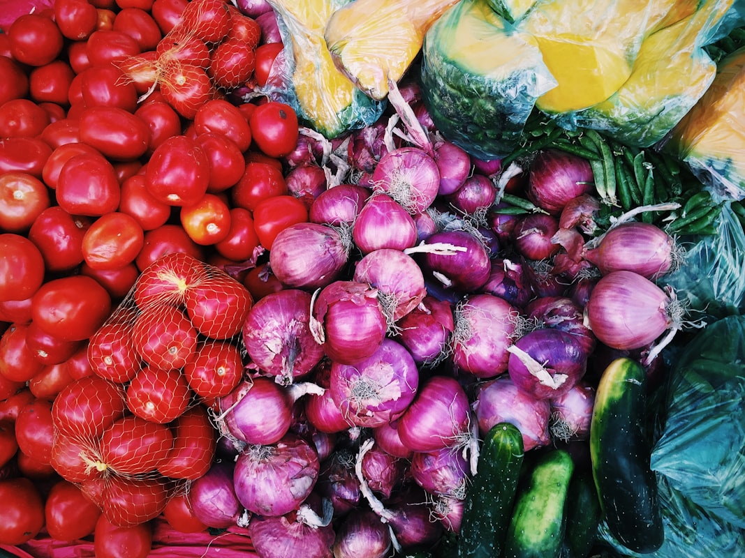 Summer produce: tomatoes, peppers, zucchini, and berries